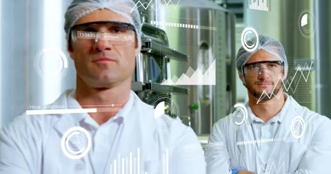 Two techs standing in food plant while camera tightening, data overlays over Stock Footage 331821003