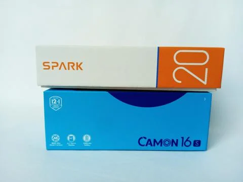 Two Tecno smartphone paper boxes package on white background. Stock Photos