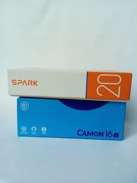 Two Tecno smartphone paper boxes package on white background. Stock Photos