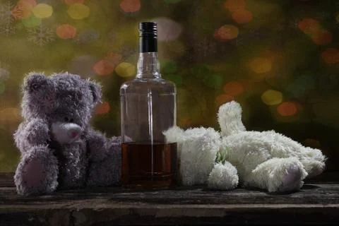 Two Teddy Bears drunk bourbon whiskey 2 Stock Photos