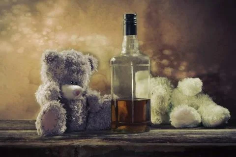 Two Teddy Bears drunk bourbon whiskey Stock-Fotos