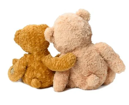 Two teddy bears sit with their backs on a white isolated background. Love and Stock Photos