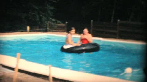 Two Teenage Girls Enjoy The Swimming Poo... | Stock Video