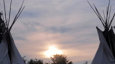 Two teepees with sunset in between Stock-Footage 146628996