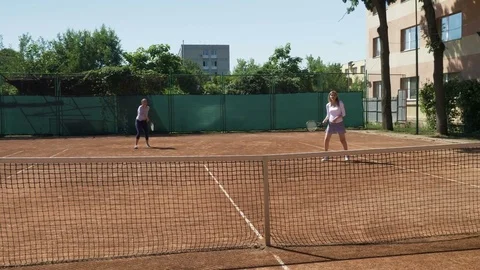 Two tennis players playing double at tennis court Stock Footage 81146874