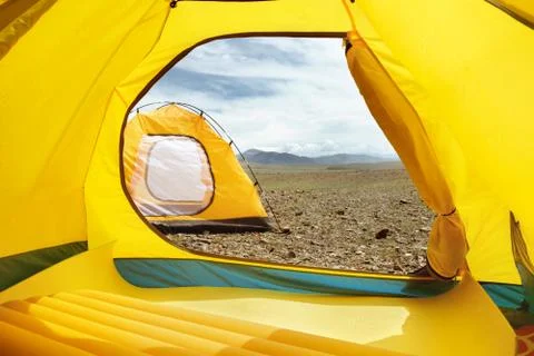 Two tents at the camp. View from inside 스톡 사진