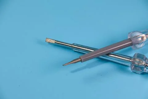 Two test pens isolated on blue background Stock Photos