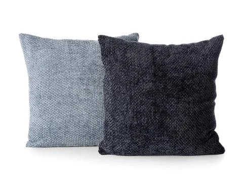 Two textured decorative throw pillows in light blue and dark gray for home de Stock Photos