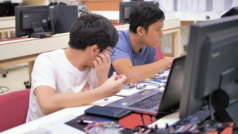 Two thai engineers work on a development project for the future in 스톡 동영상 115638622