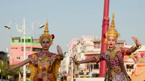 Two Thai Khon Dancers Perform Traditional Dance in Front of Giant Swing Stock Footage 338430015