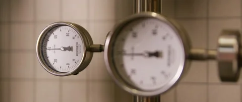 Two thermometer temperature gauges holding constant at around forty celsius Stock Footage 112895428