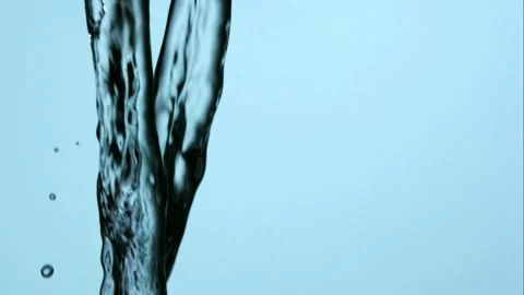 Two thick vertical water streams fall and oscillate in slow motion Stock Footage 326625864