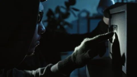 Two Thieves Trying to Guess Multi-Digit Code when Cracking Electronic Safe Stock Footage 321675865