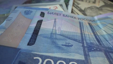 Two thousand russian rubble in macro shot. Crimea bridge with ship and seagull Stock Footage 141575155