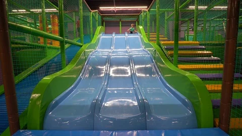 A two-to three-year-old boy wearing a turquoise t-shirt and dark blue pants  Stock Footage 104028726