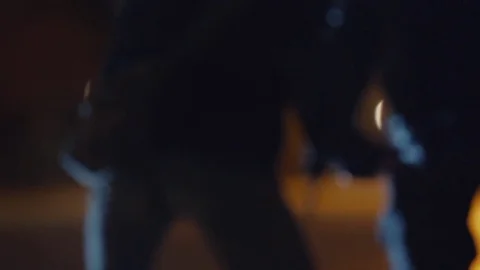 Two thugs with knifes face each other at dark park at night Video stock 73887884