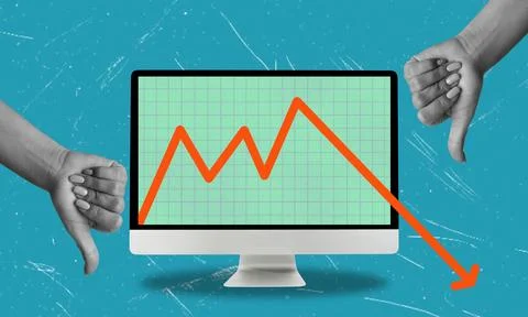 Two Thumbs Down on a Computer Screen Showing a Dropping Graph Foto stock
