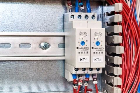 Two time relays with adjustments in the electrical Cabinet. Stock Photos