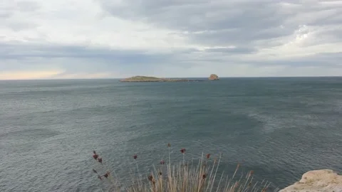 Two tiny islands in front of San Cibrao in a windy day Stock Footage 236798469