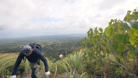 Two tired trekker reached the peak of a mountain Stock Footage 116404680