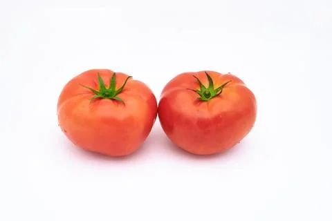 Two tomatoes on a white background Stock Photos