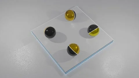 Two-tone black gold balls roll back and forth on the rough white surface. animat Video stock 154770171
