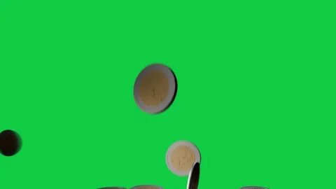 Two-tone coins dropping from top, rotating, colliding, settling into loose heap Stock Footage 337887597