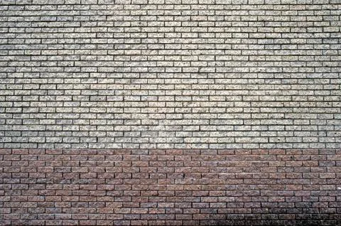 Two-tone gray-brown wall texture made of small bricks. A discreet background. Foto stock