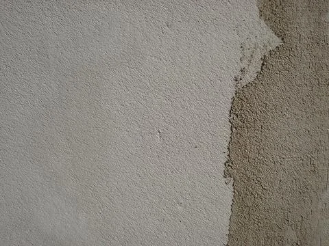 Two-tone plaster on the wall. Gray wall texture background. Stock Photos