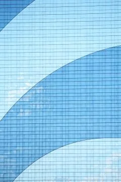 Two toned blue windows of a large skyscraper Stock Photos