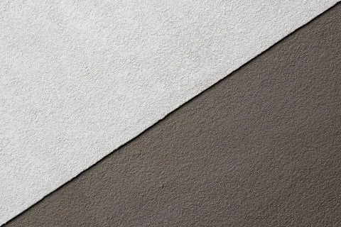 Two tones brown texture on concrete wall, triangle shape Foto stock