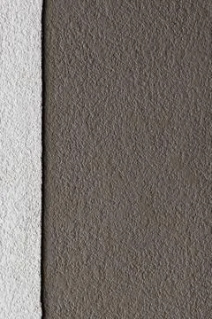 Two tones brown texture on concrete wall, vertical pattern Stock Photos