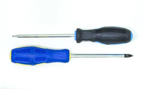 Two tool screwdrivers lie parallel on a white isolated background Stock Photos