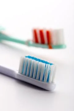 Two toothbrushes isolated on white Stock Photos