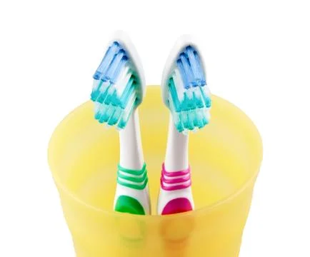 Two toothbrushes in jar Stock Photos