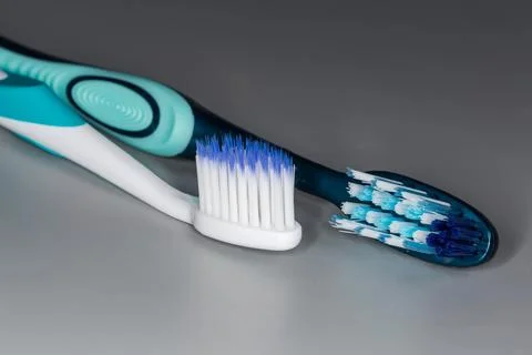 Two toothbrushes with soft and hard bristles, close-up Stock Photos
