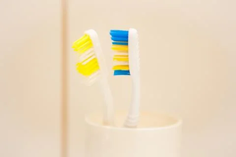 Two toothbrushes in the white box, close up Stock Photos