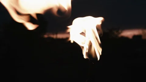 Two torches burning sunrise Stock Footage 121663591