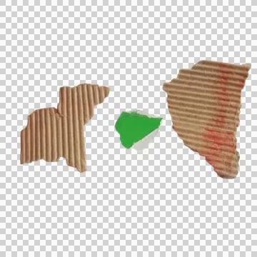 Two torn pieces of brown corrugated cardboard with a small green paper scra.. Stockfoto's