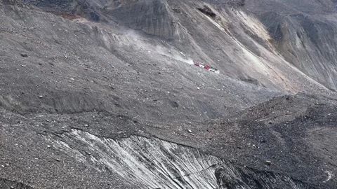 Two Tour Buses Passing on Bumpy Rocky Dirt Road to Athabasca Glacier, Canada Video stock 300152511