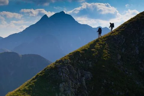 Two tourist with a backpack at mountines range Stock Photos