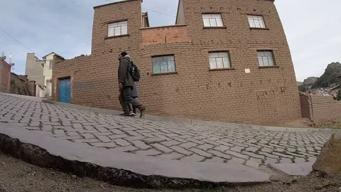 Two Tourists Holding Hands Going Up Calvary Hill in Copacabana, Bolivia Stock Footage 84908775
