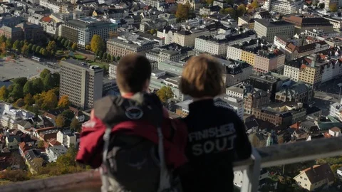Two Tourists Look Out Over Bergen City Norway Europe Stock Footage 69720410