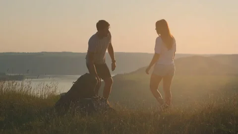The two tourists standing on the beautiful mountain top. slow motion Stock Footage 159596198