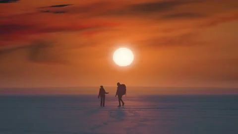 The two tourists walking on a sunset background. slow motion Stock Footage 203708962