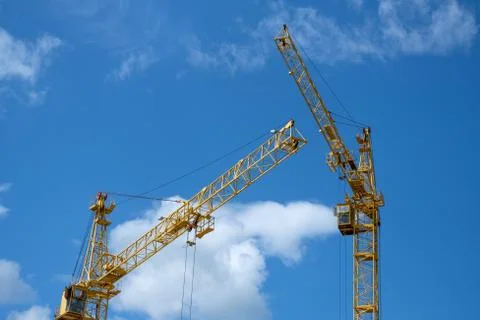 Two tower crane on sky background Stock Photos