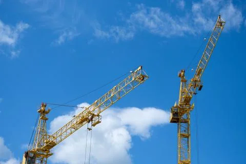 Two tower crane on sky background Stock Photos