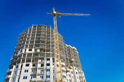Two tower cranes building Stock Photos