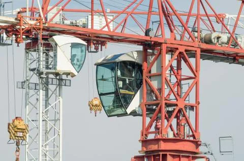 Two Tower Cranes Operator Cabins Facing Stock Photos