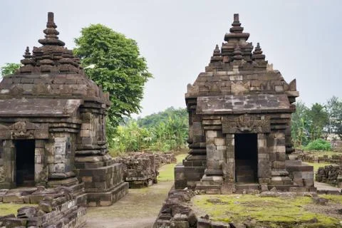 Two towers separated by a grass path in a Hindu stone temple Stock Photos